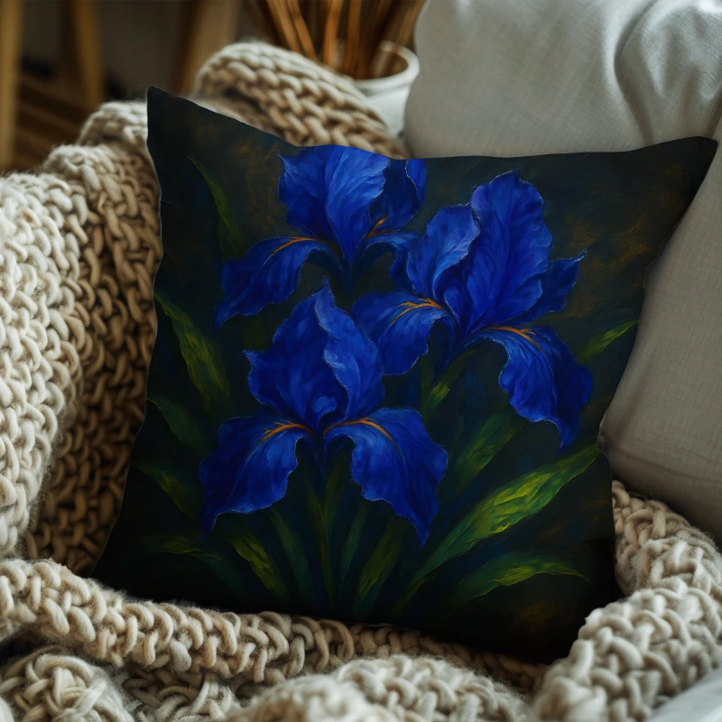 Cobalt iris abstract oil pillow styled on dark sofa, subtle gold undertones and silver accents