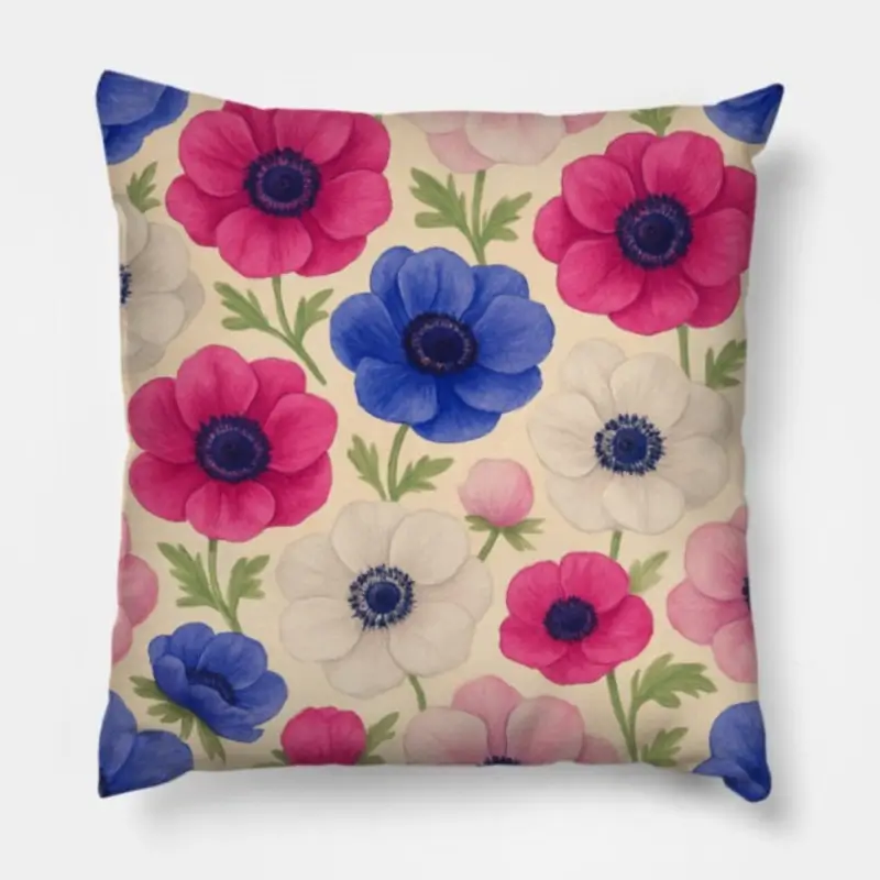 Floral throw pillow with Anemone Coronaria watercolor design in blue, fuchsia, white, and blush pink