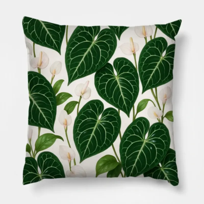 Floral throw pillow with Anthurium crystallinum leaves and pale blooms on a clean white background