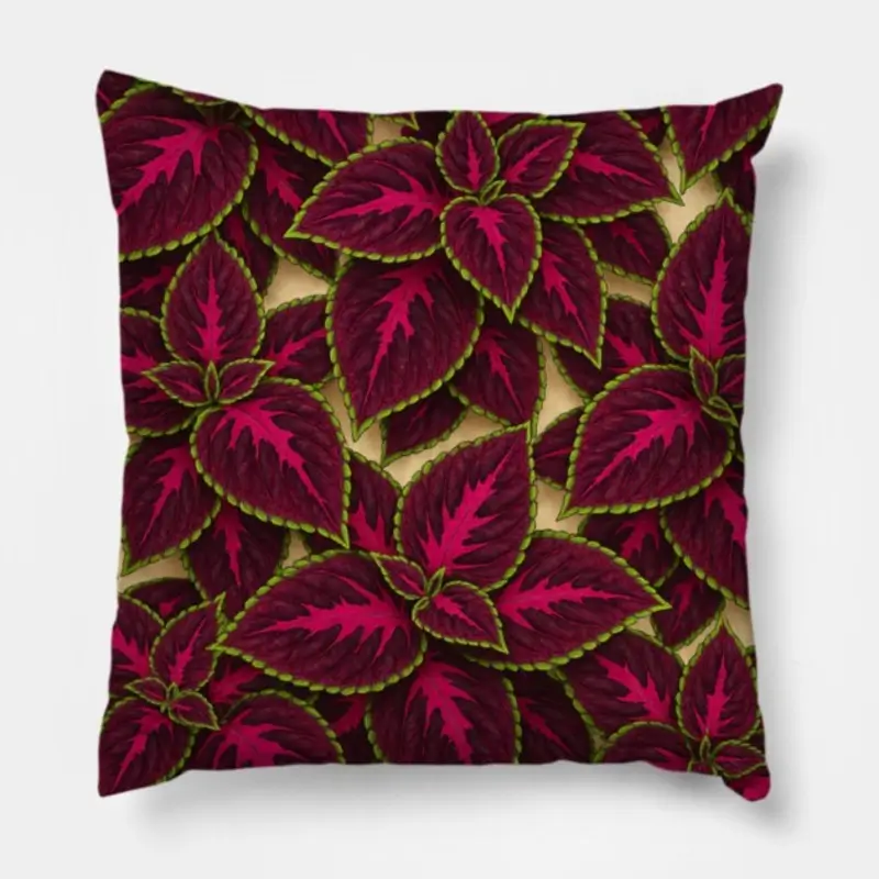 Floral throw pillow with Begonia Rex leaf design in vivid green, bright pink, and turquoise highlights