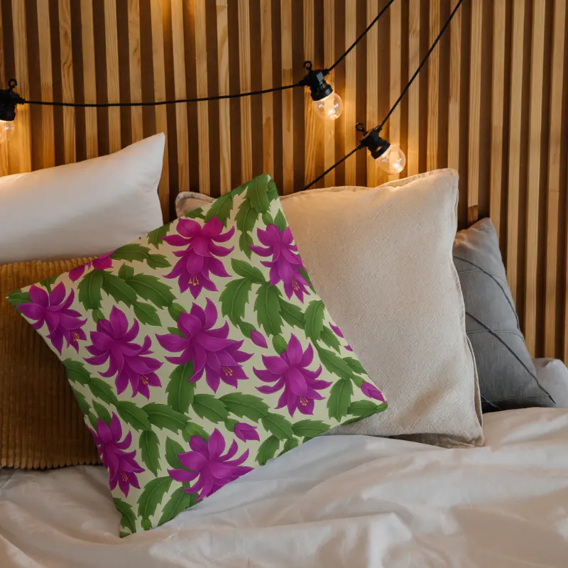 Decorative cushion featuring Christmas Cactus blossoms in radiant purple and magenta on a cozy bed