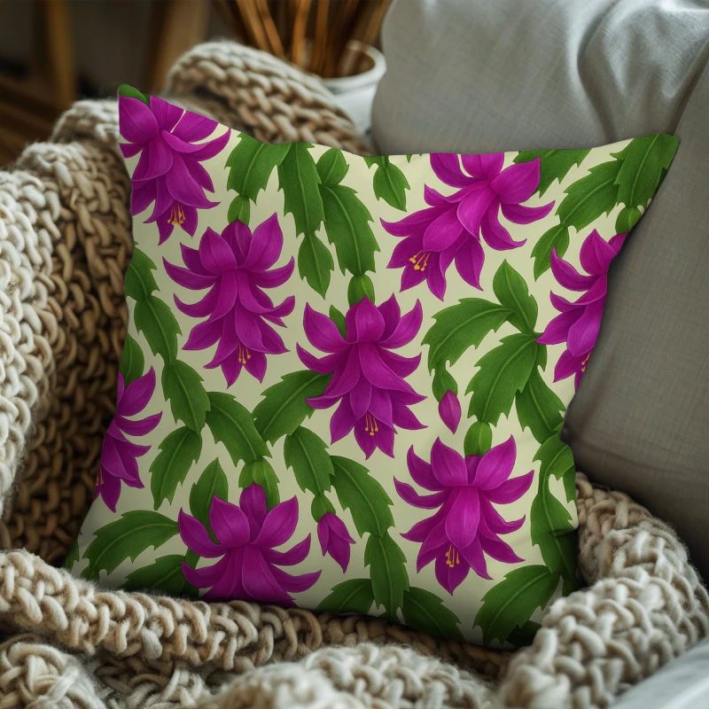 Modern floral throw pillow with cascading Christmas Cactus blossoms styled on a sofa