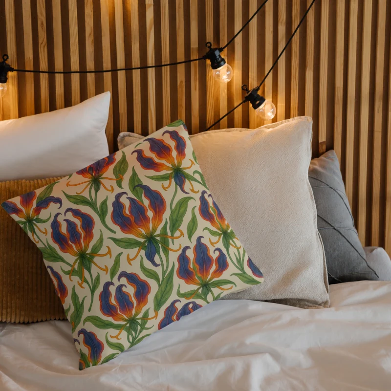 Decorative gloriosa superba watercolor gouache floral throw pillow on a layered bed