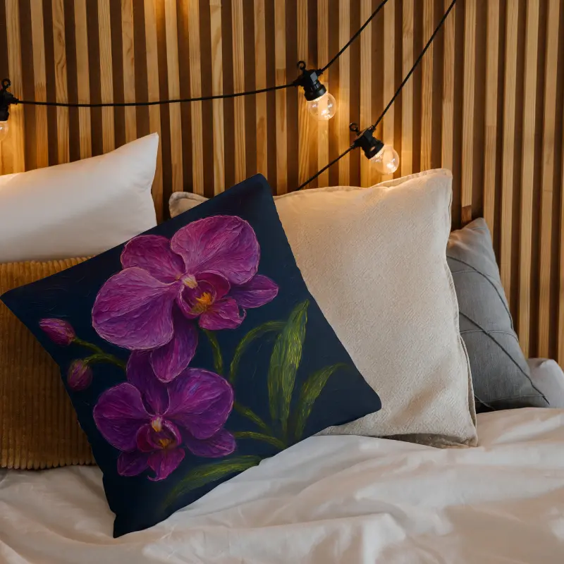 Purple orchid impasto floral throw pillow on a modern bed with dark blue accent wall