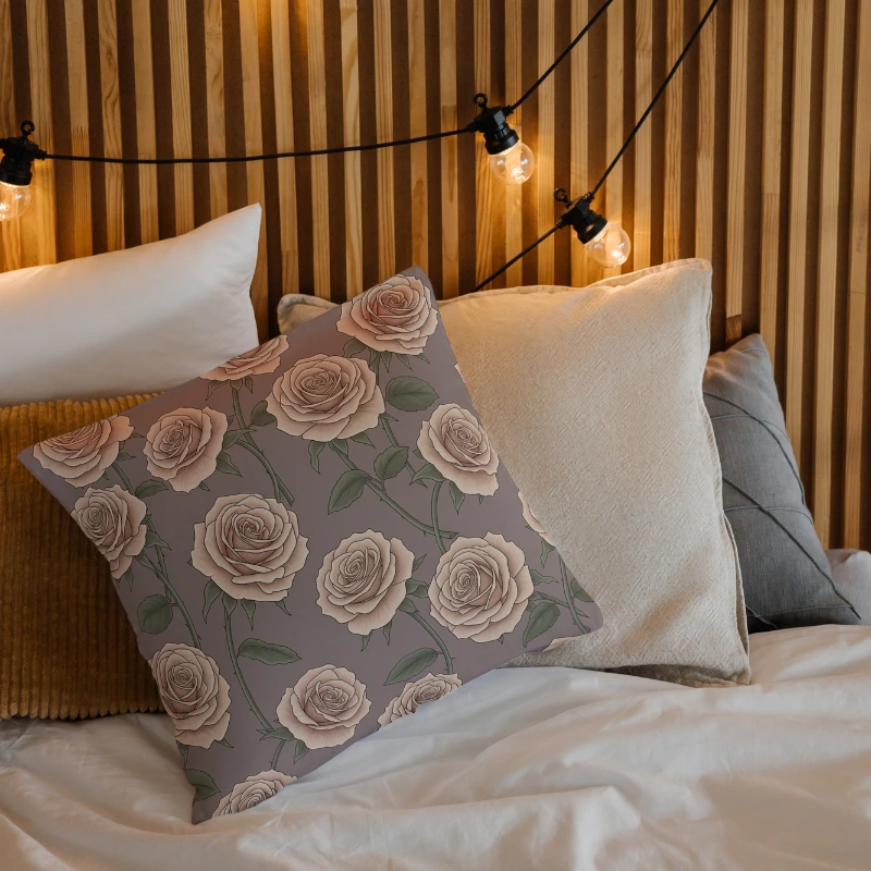 Elegant rose throw pillow on modern accent chair with minimalist styling