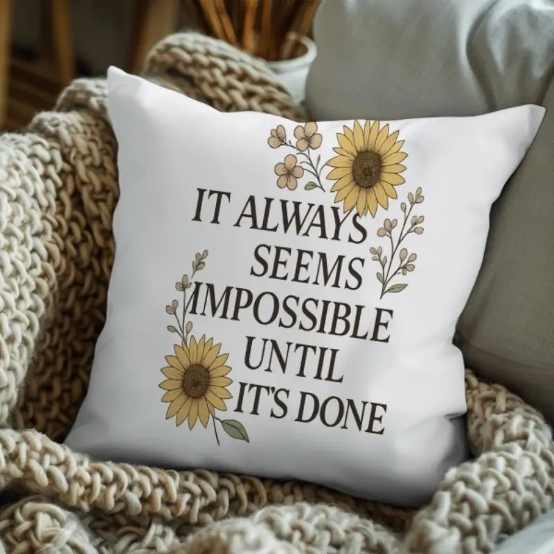 Motivational quote pillow styled on a contemporary sofa in a modern office space